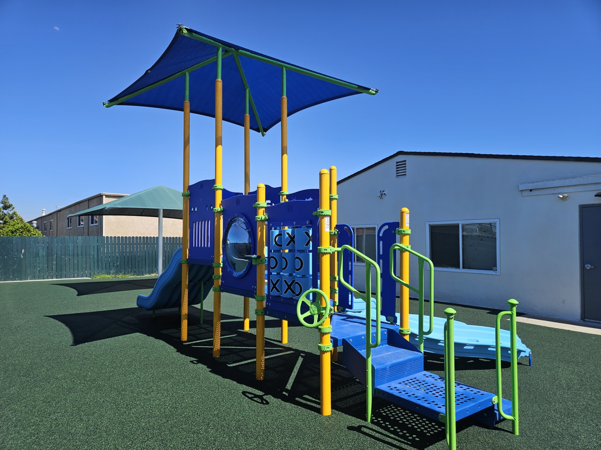 Completed church playground installation at Adventure Point Early Learning Center, featuring safe rubber surfacing and modern play equipment.