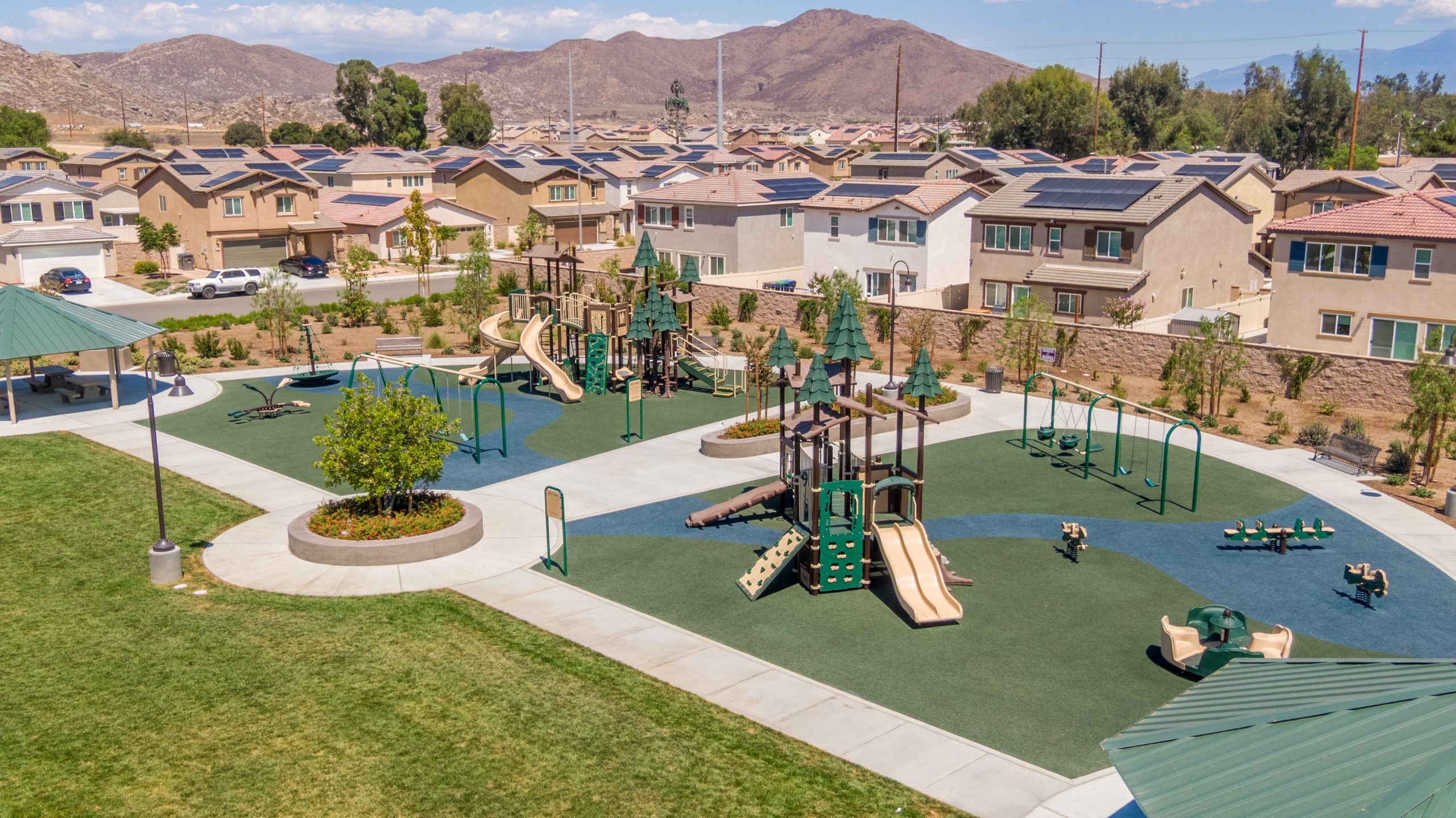 Forest accents and tree structures at La Pradera North Park, part of the Winchester playground project.