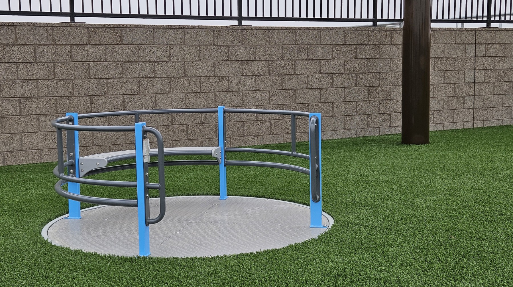 ADA spinner installed in the upper and lower grade playground for a safe school playground installation