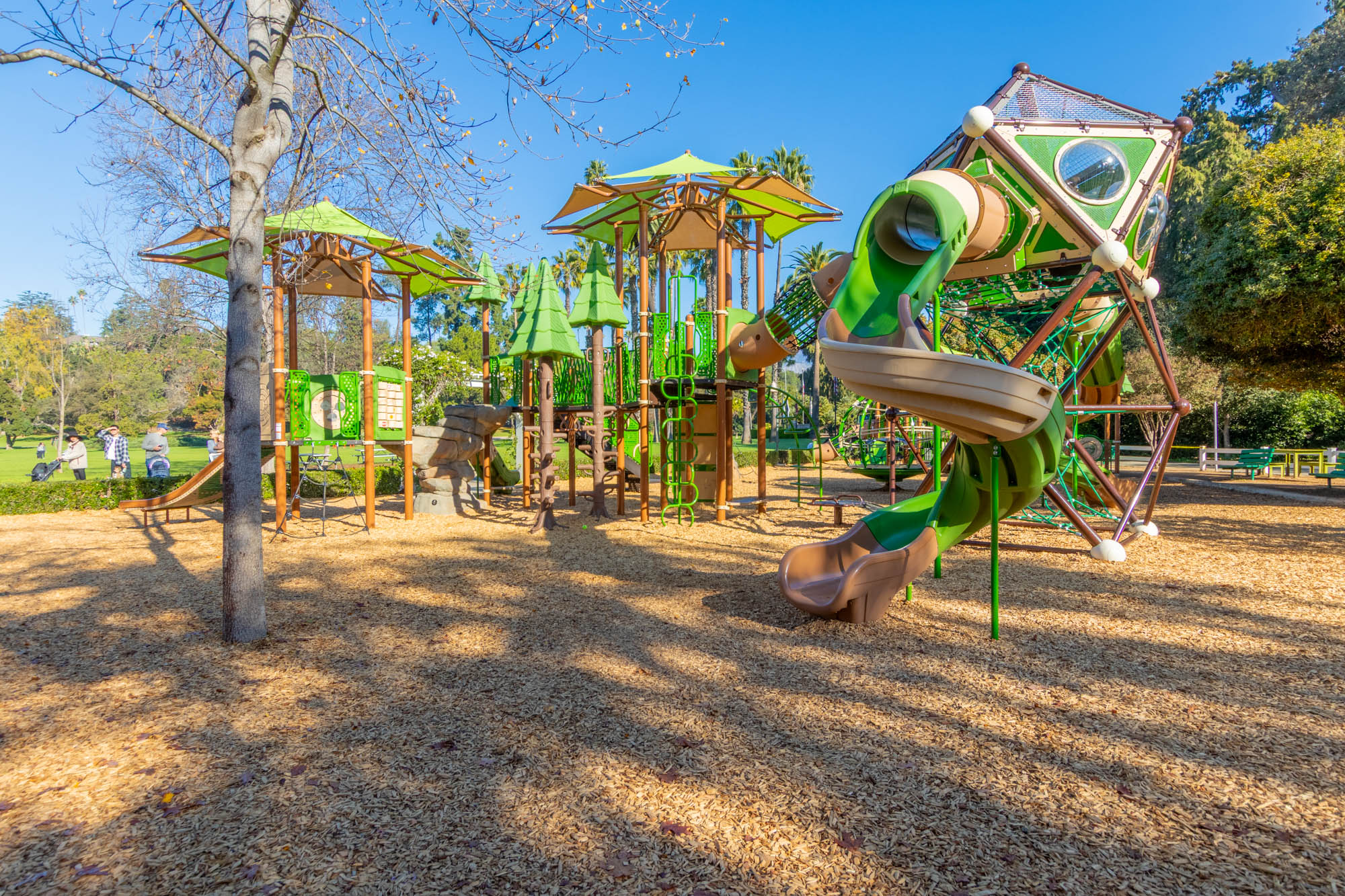5–12 playground area with 2–5 playground visible at Lacy Park in San Marino, featuring nature-themed equipment and shade structures